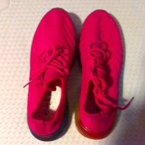 Brand new Pink tennis shoes with colorful bottoms
